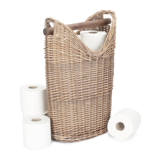 The Aldwych Loo Stand – handwoven round wicker toilet roll holder with antique wash finish, shown holding three toilet rolls in a bathroom setting to highlight its spacious design, natural texture, and timeless utility.