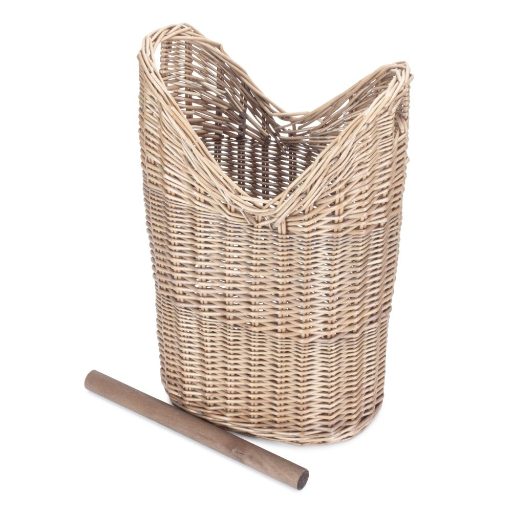 The Aldwych Loo Stand – round handwoven wicker toilet roll holder with antique wash finish, shown empty from the side to highlight its curved silhouette, spacious interior, and natural weave