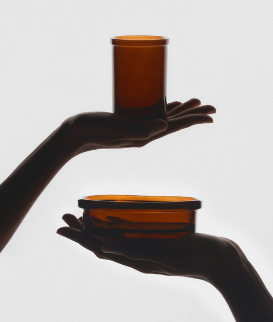 The Wetherby Amber Glass Bathroom Duo – vintage-style toothbrush holder and matching soap dish in translucent amber glass, styled together for timeless grooming rituals.
