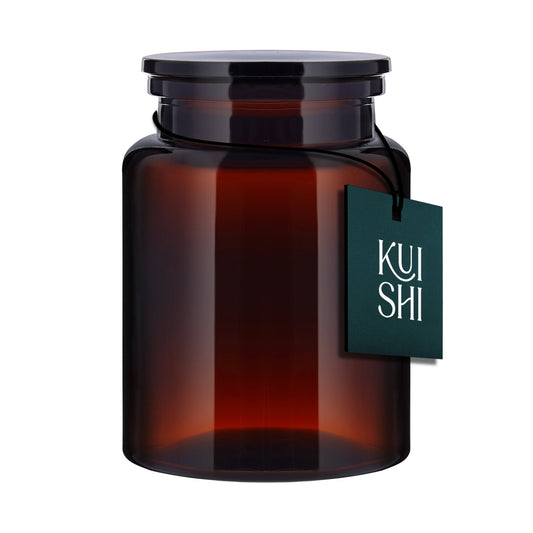 The Wetherby Amber Glass Storage Jar – large apothecary-style jar in translucent amber glass with wide-mouth design, styled for bath salts, cotton pads, or basin-side essentials.