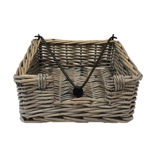 The Wickham Table Keeper — handwoven antique wash wicker napkin holder with open cradle design, styled for timeless tabletop charm and rustic hospitality.