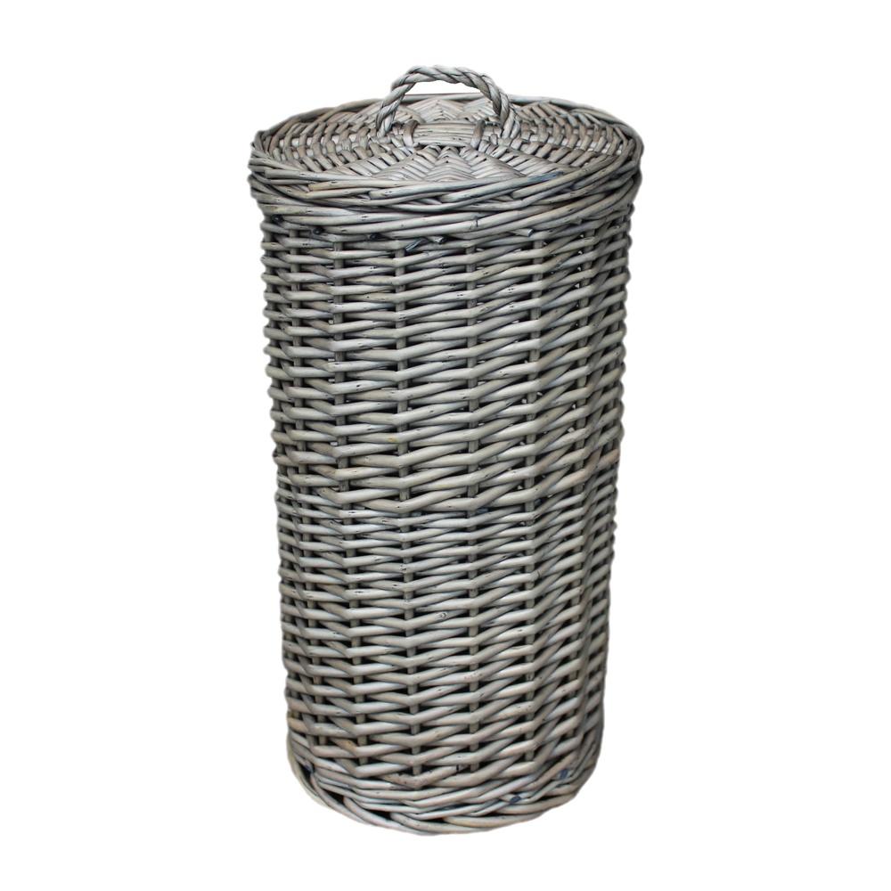 The Wickham Wicker Toilet Roll Basket – round handwoven wicker basket styled to hold three toilet rolls, shown in a bathroom setting to evoke timeless utility and countryside charm.