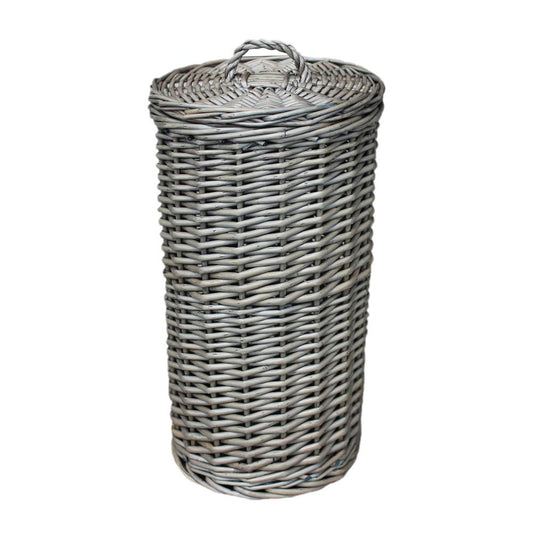 The Wickham Wicker Toilet Roll Basket – round handwoven wicker basket styled to hold three toilet rolls, shown in a bathroom setting to evoke timeless utility and countryside charm.