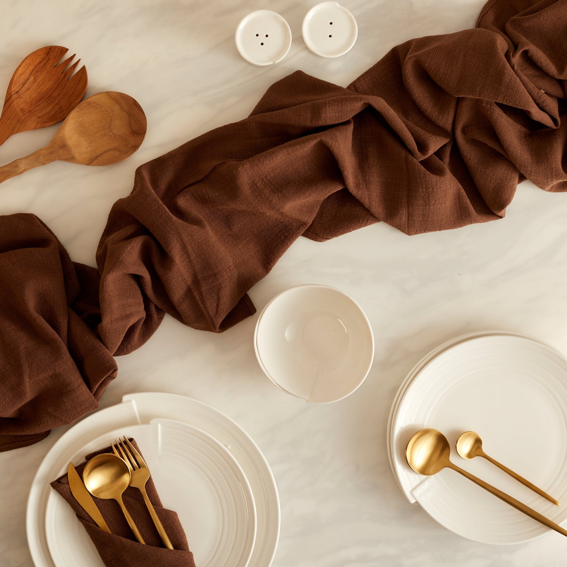 Branwell Brown gauze table runner in soft cotton, styled on a rustic table with gold cutlery and white ceramic tableware for heritage-inspired dining and soulful layering.