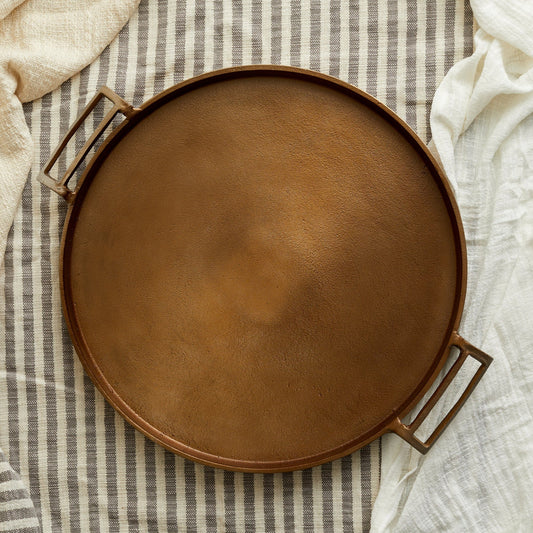Brontë Bronze Round Tray by Timeless Trading Co. – handcrafted aluminium tray in warm bronze finish, rustic round style for soulful serveware and display