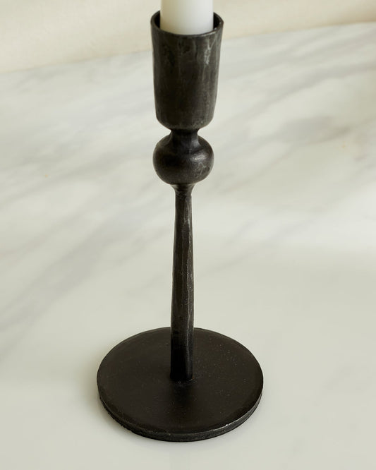 Close view of Coalbrook iron black candle holder showing matte texture and rounded shape