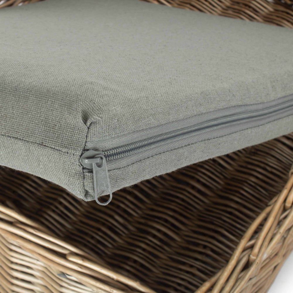 Close-up of The Dookie Den showing antique wash willow frame and soft cushion texture – handwoven dog bed with removable cover and heritage-inspired detail