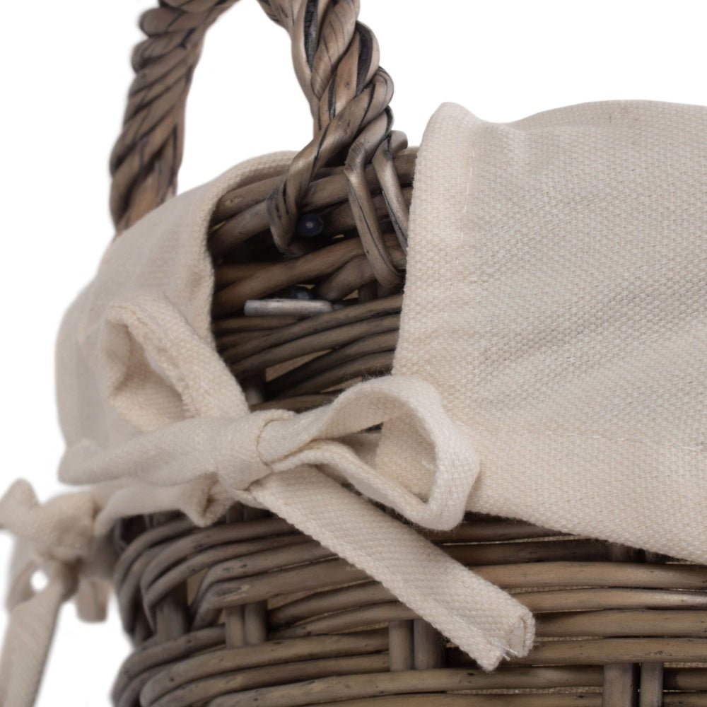 Close-up of The Elmsmere Basket showing handwoven wicker weave and soft white cotton lining – crafted for countryside laundry rituals and timeless cottage charm