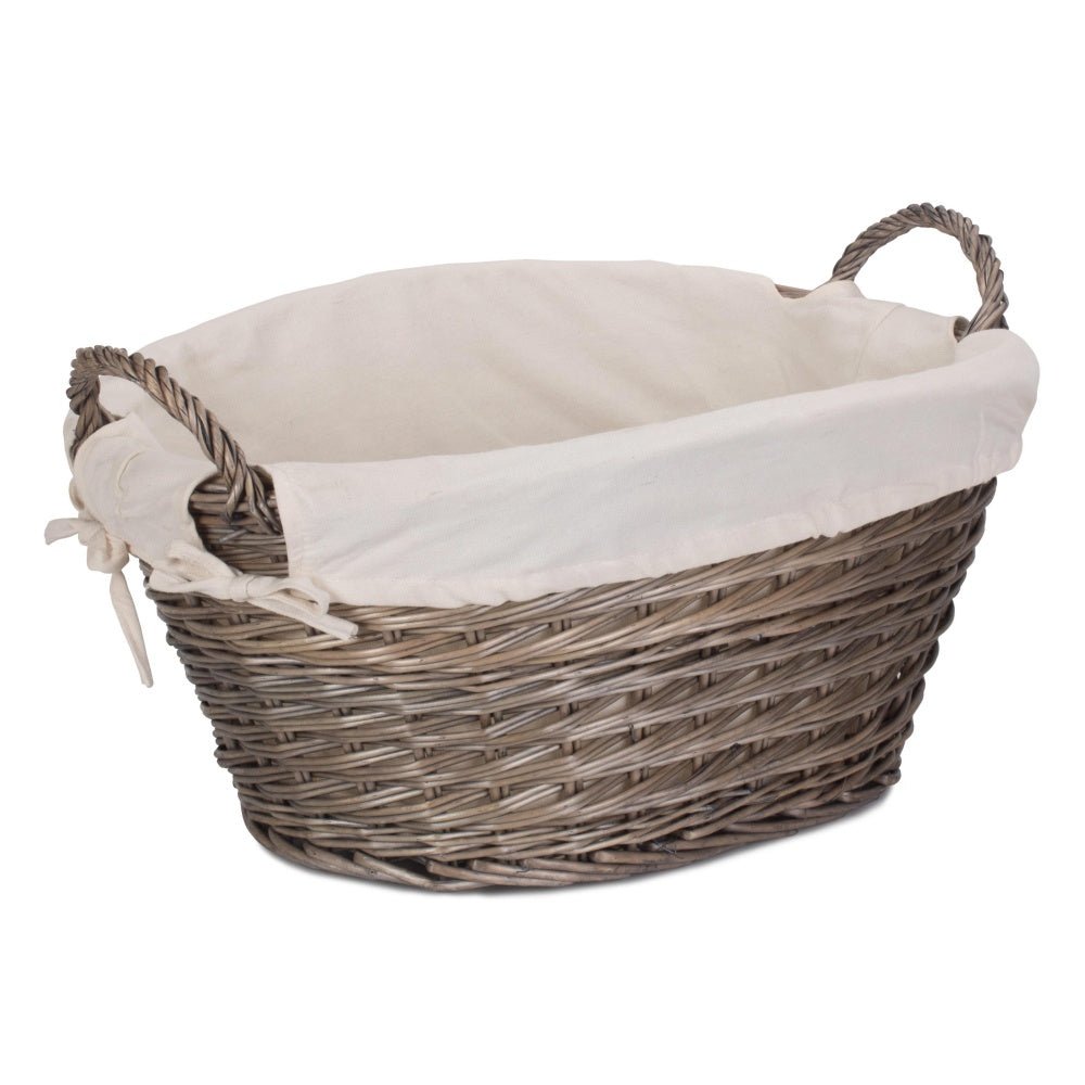 Full view of The Elmsmere Basket – small handwoven wicker laundry carrier with soft white lining, crafted for countryside homes and gentle linen rituals