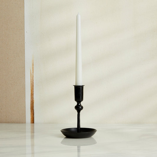 Hand-forged iron candle holder in matte black finish, rustic forge-style decor for winter mantle or festive table setting