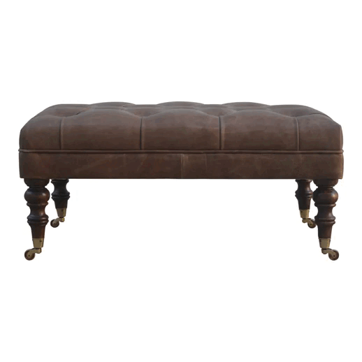 Buffalo hide ottoman with deep-buttoned top and castor-legged walnut mango wood base, part of The Godolphin Collection, suitable as a window seat or hallway bench, approx. 90cm wide × 60cm deep × 45cm high