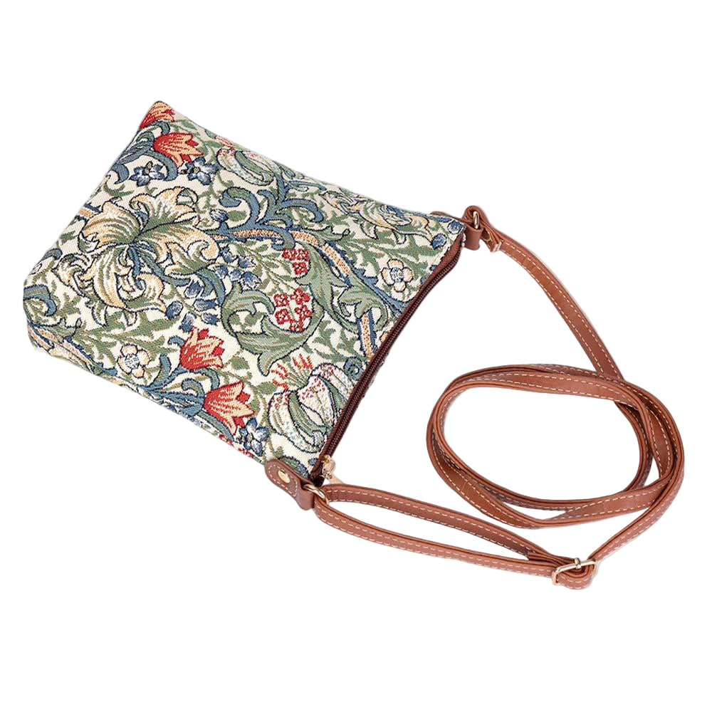 Golden Lily sling bag in William Morris tapestry shown lying flat with zip closure, vegan leather trim and floral pattern in warm tones