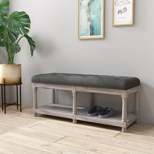 Angled view of grey linen bench with button-tufted seat and open base, part of The Haddon Hall Still collection by The Timeless Trading Co.
