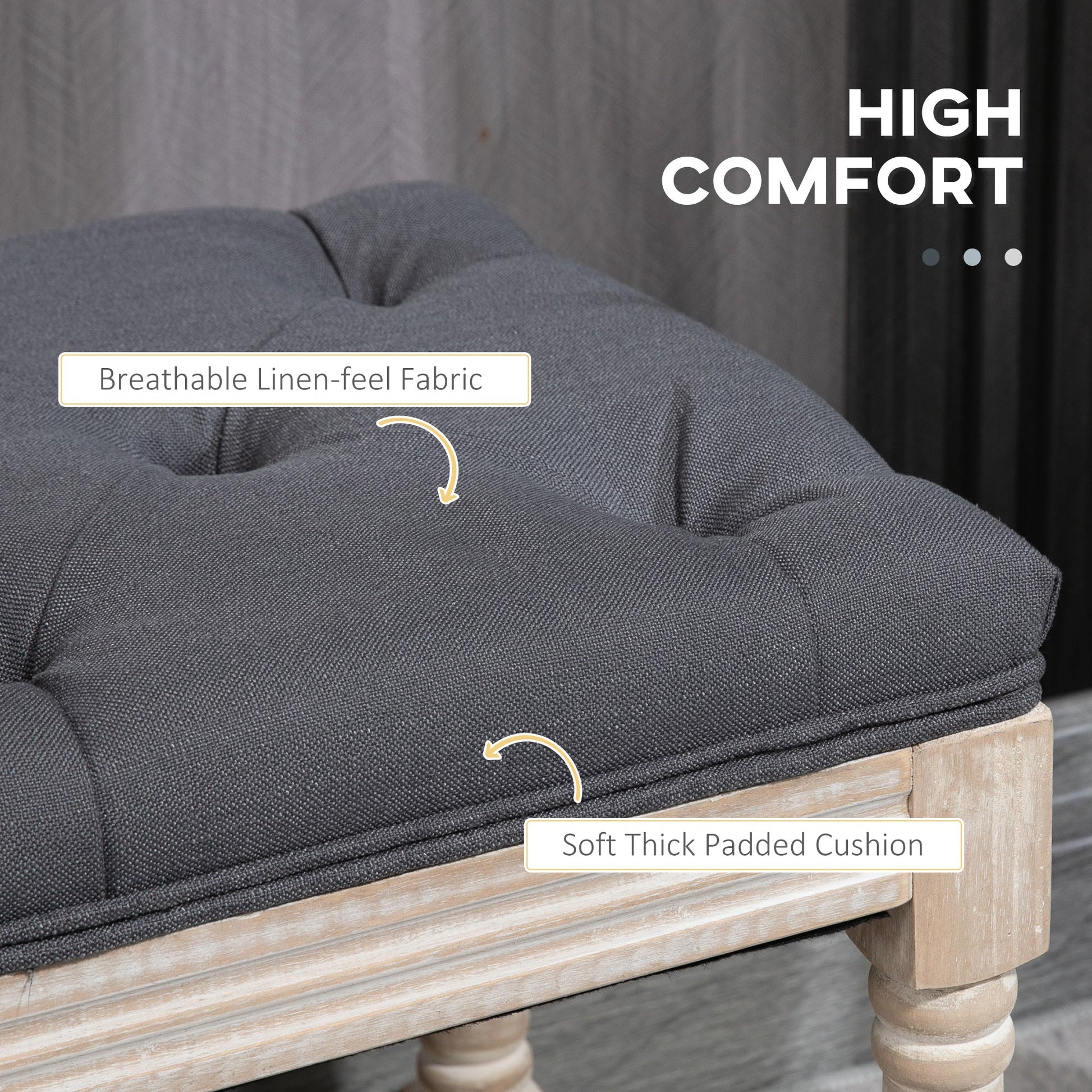 Grey linen bench with button-tufted seat placed at the foot of a bed, styled in a soft-toned bedroom setting, part of The Haddon Hall Still collection by The Timeless Trading Co.