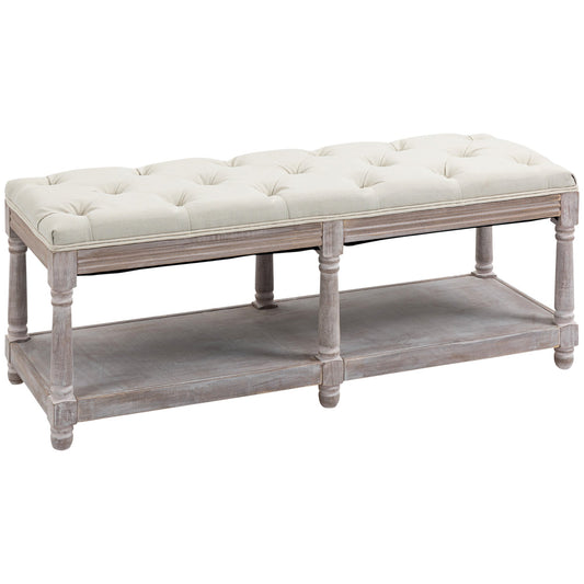 Angled view of cream linen bench with button-tufted seat and single hidden shelf, part of The Haddon Hall Welcome collection by The Timeless Trading Co.