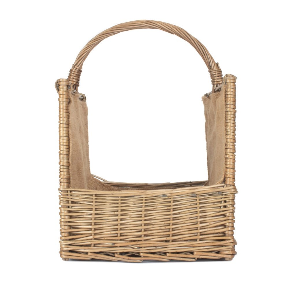 Side profile of antique wash wicker log basket showing open-end design and handwoven willow texture