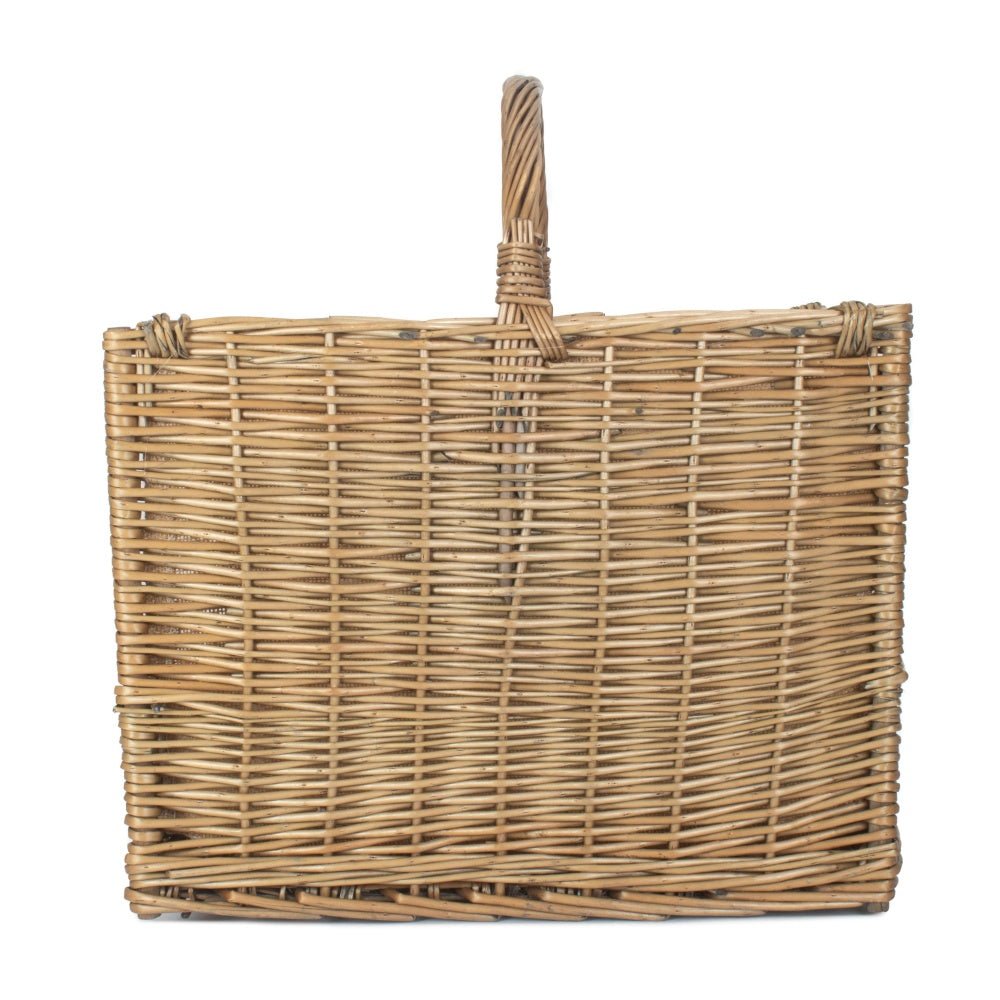 Close-up of antique wash wicker weave showing handwoven willow texture and curved detailing on The Harrowgate Hearthkeeper log basket