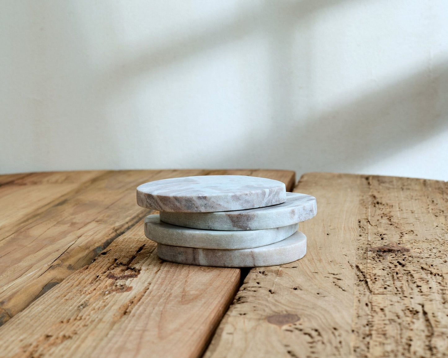 Handcrafted marble coasters styled on a rustic table, showcasing artisan elegance and timeless British countryside charm.