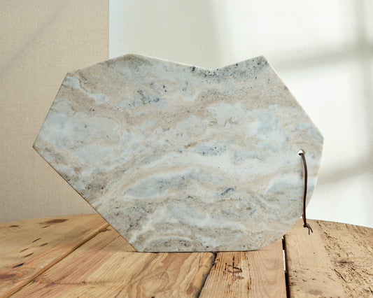 Heritage marble serving board with artisan finish, handcrafted for soulful charcuterie and elegant dining.