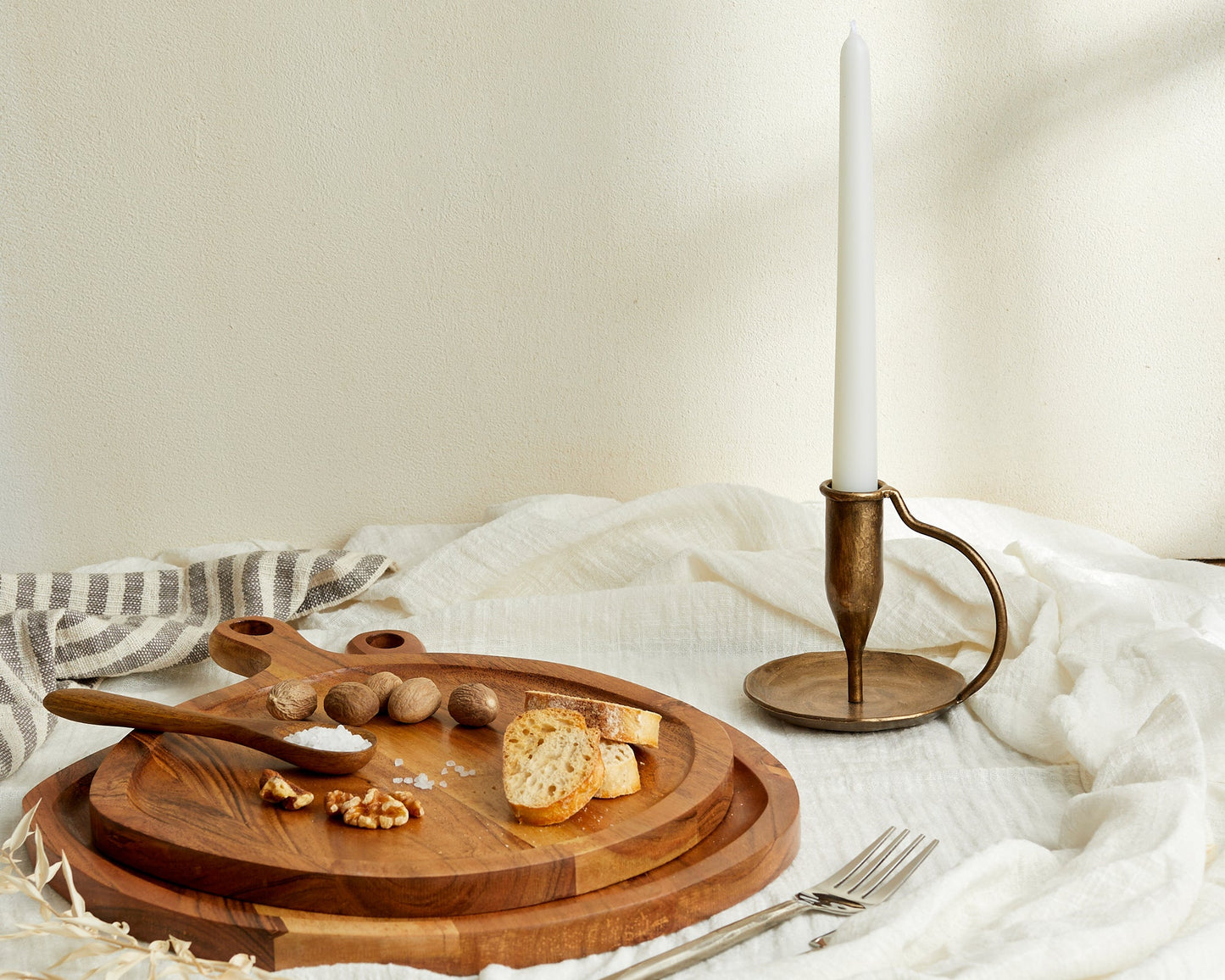 Iron candle holder brushed gold Ashbourne Hearth styled with serving boards on linen cloth
