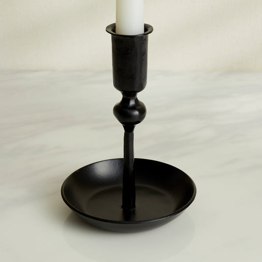 Close-up of Noa black iron candle holder with matte finish, forge-style decor for rustic mantle or winter table setting