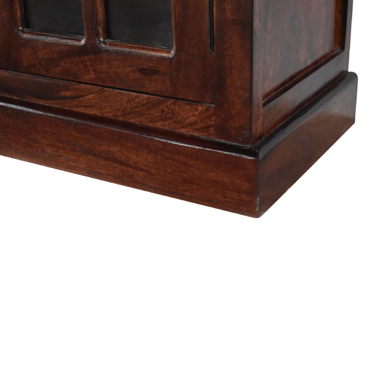 Close-up of bottom corner on cherry-glazed sideboard crafted from solid mango wood, part of The Osborne Collection, showing leg structure and finish detail, approx. 165cm wide × 38cm deep × 90cm high
