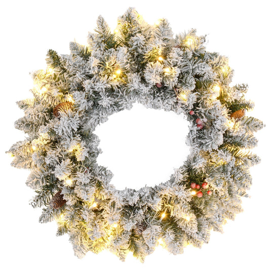 60-inch snowy Christmas wreath with lifelike green branches, pinecones, red berries, and warm white LED lights — rustic, festive, and ready to hang.