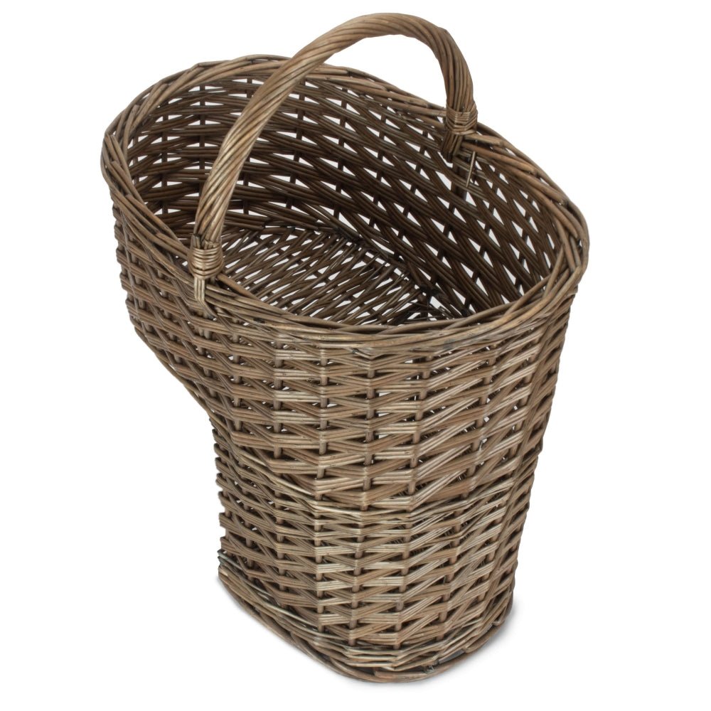 Top-down view of antique wash willow stair basket — unlined, curved handle visible, ideal for hallway storage