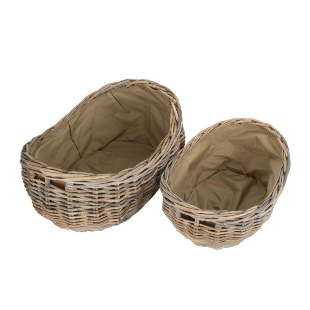 Boat-shaped rattan log basket with Cordura lining — styled for countryside warmth and heritage-inspired home rituals