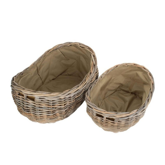 Boat-shaped rattan log basket with Cordura lining — styled for countryside warmth and heritage-inspired home rituals