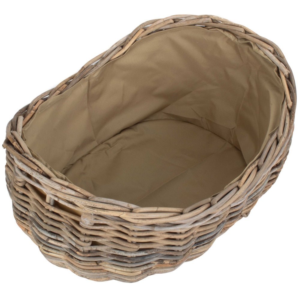 Small boat-shaped rattan log basket with Cordura lining — handwoven fireside storage for compact spaces, inspired by coastal cottages and countryside hearths