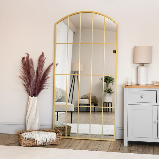 Full-length arched gold lattice mirror with windowpane design — styled for hallway light and countryside elegance