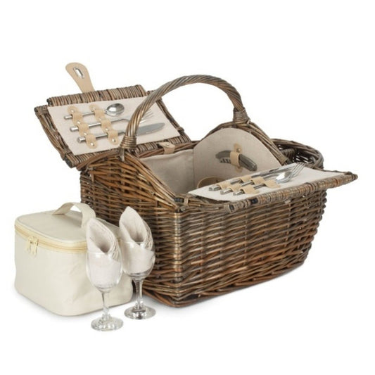 Boat-shaped wicker picnic basket with fitted interior — styled for countryside walks, dockside lunches, and timeless outdoor gatherings