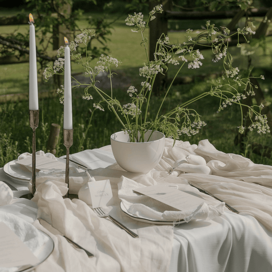 Weldon Iron Candle Holder Set – antique brass finish, styled on formal wedding table with elegant place settings and soft candlelight for timeless celebration