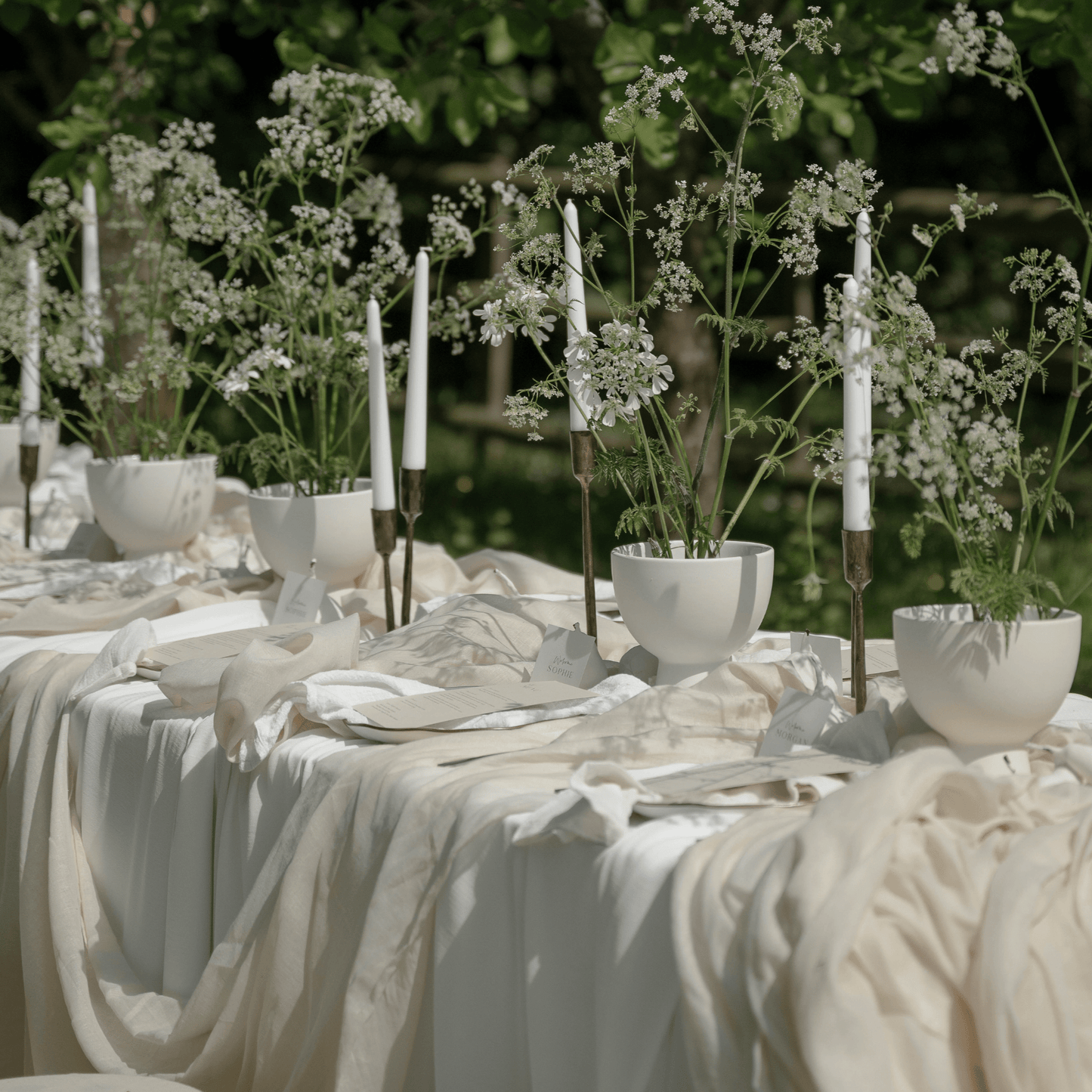 Weldon Iron Candle Holder Set – antique brass finish, styled on wedding table with natural organza and white flowers for timeless countryside elegance