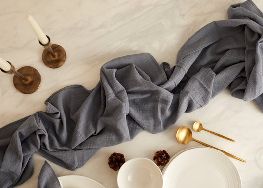 Wendell blue gauze table runner in soft cotton, styled with rustic ceramics and candlelight for heritage-inspired tablescapes and soulful countryside dining.