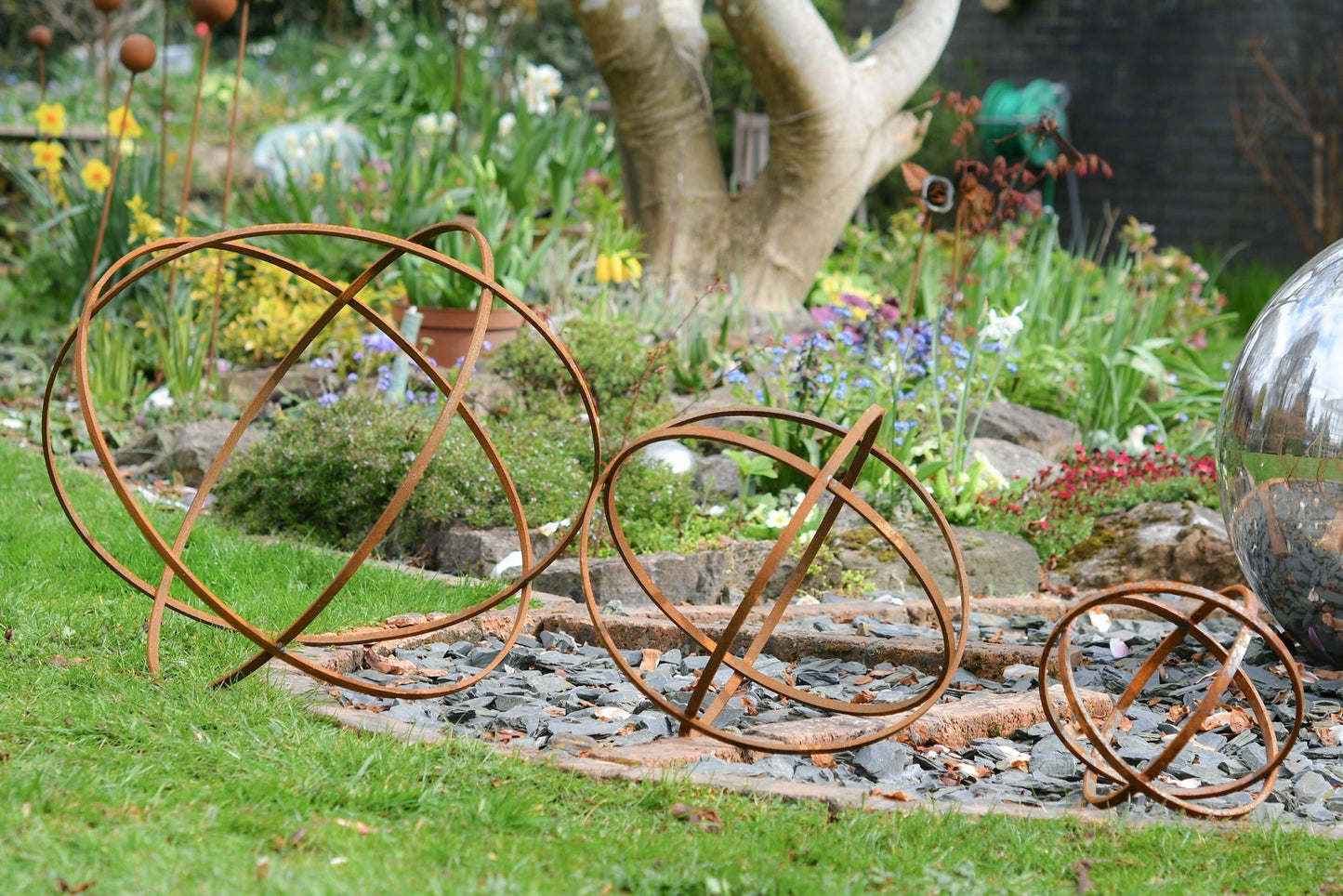 Whispering Garden Sphere Trio – Rusted Steel Sculptures - The Timeless Trading Co.
