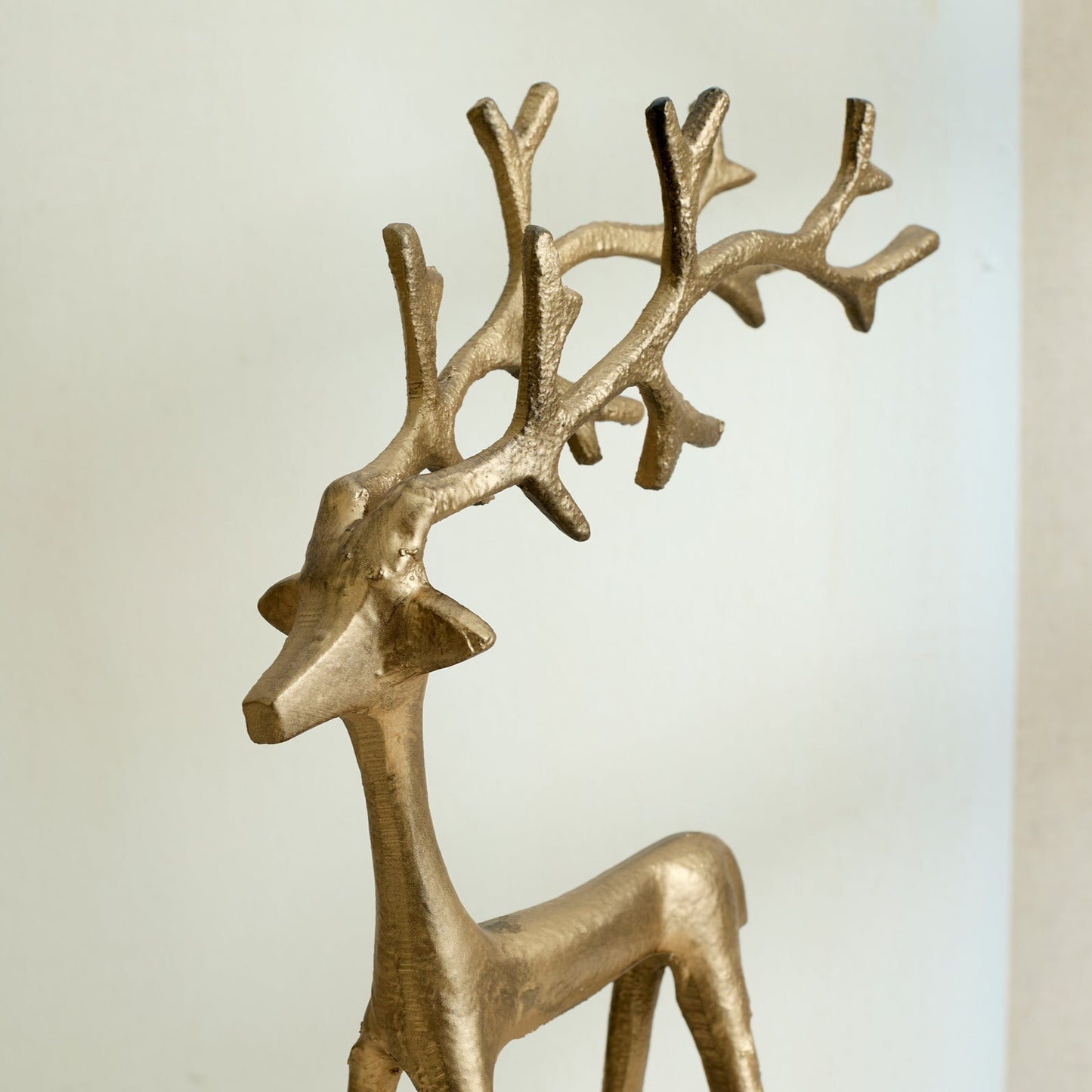 Close-up of Wickham Gold Reindeer Ornament – brushed gold iron finish with hand-forged detail, styled for festive mantle glow and timeless Christmas charm