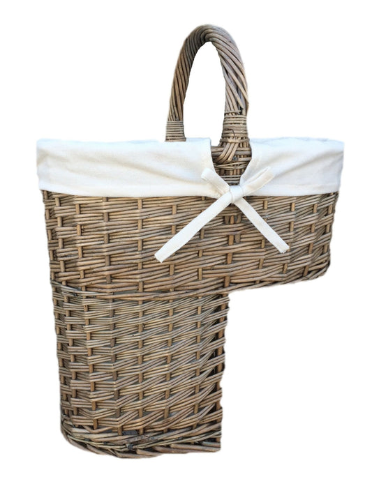 Front view of antique wash willow stair basket with curved base and central carry handle, part of The Wickham Tread collection by The Timeless Trading Co.