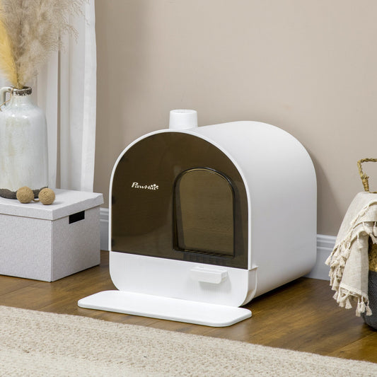 The Willow Whiskers Hooded Cat Litter Box – shown in a cosy interior scene on a wooden floor beside a woven basket and neutral-toned rug, blending discreet feline comfort with heritage-inspired home styling