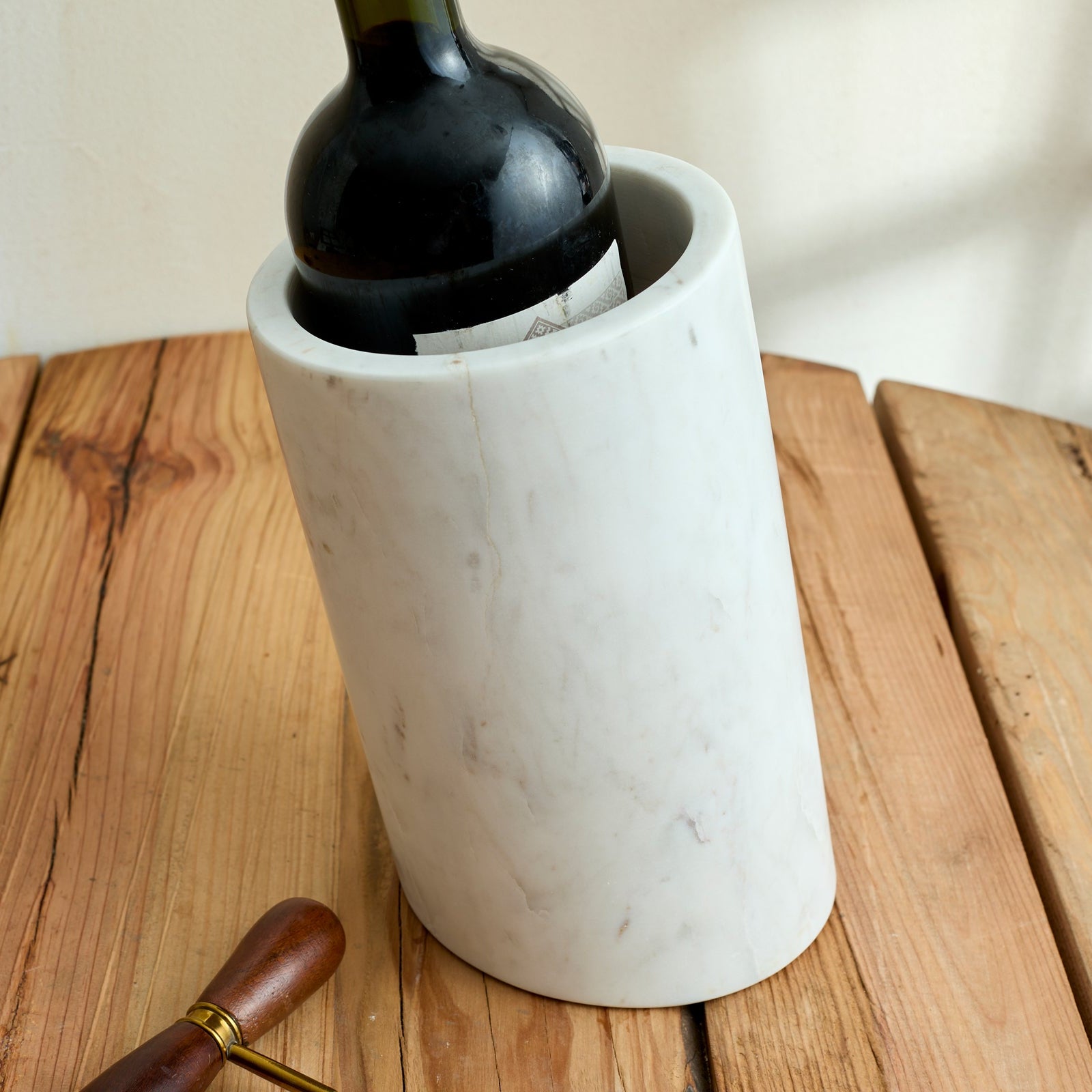 Winsford Marble Wine Holder – close-up of handcrafted white marble with natural veining, showcasing sculptural detail and timeless hosting charm