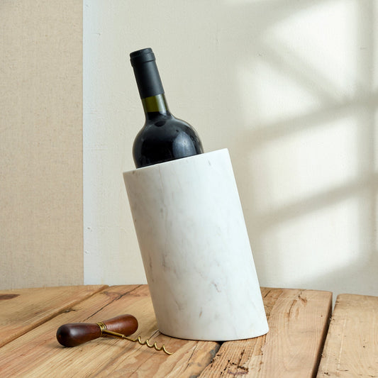 Winsford Marble Wine Holder – handcrafted white marble with natural veining, styled for timeless hosting and sculptural elegance in countryside settings