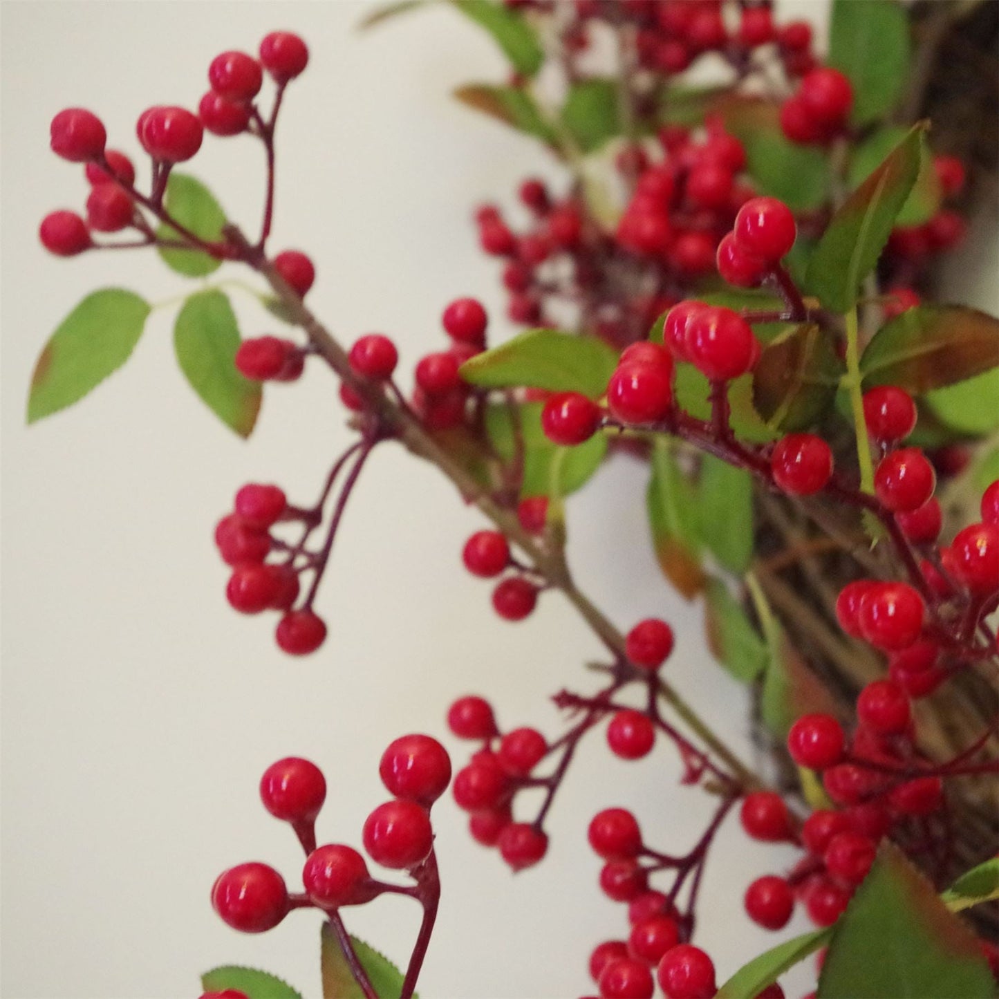 Close-up of The Winthrop wreath redberry cluster, 24 inch festive decor with rustic foliage and heritage-style seasonal texture