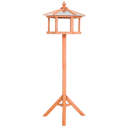 Freestanding wooden bird feeder table in natural fir, rustic garden stand for winter feeding and countryside wildlife watching