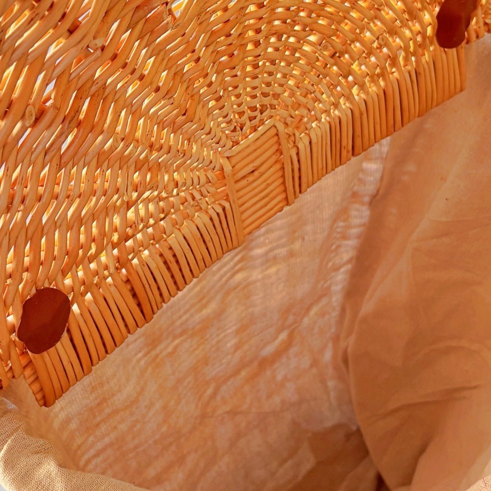 Interior of The Malbury Market Trolley — showcasing spacious full buff willow weave and upright basket design, crafted for timeless errands and rustic home storage.