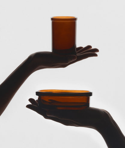 The Wetherby Amber Glass Bathroom Duo – vintage-style toothbrush holder and matching soap dish in translucent amber glass, styled together for timeless grooming rituals.