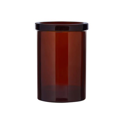 The Wetherby Amber Glass Toothbrush Holder – vintage-style bathroom cup in translucent amber glass, styled beside a basin for timeless grooming rituals.