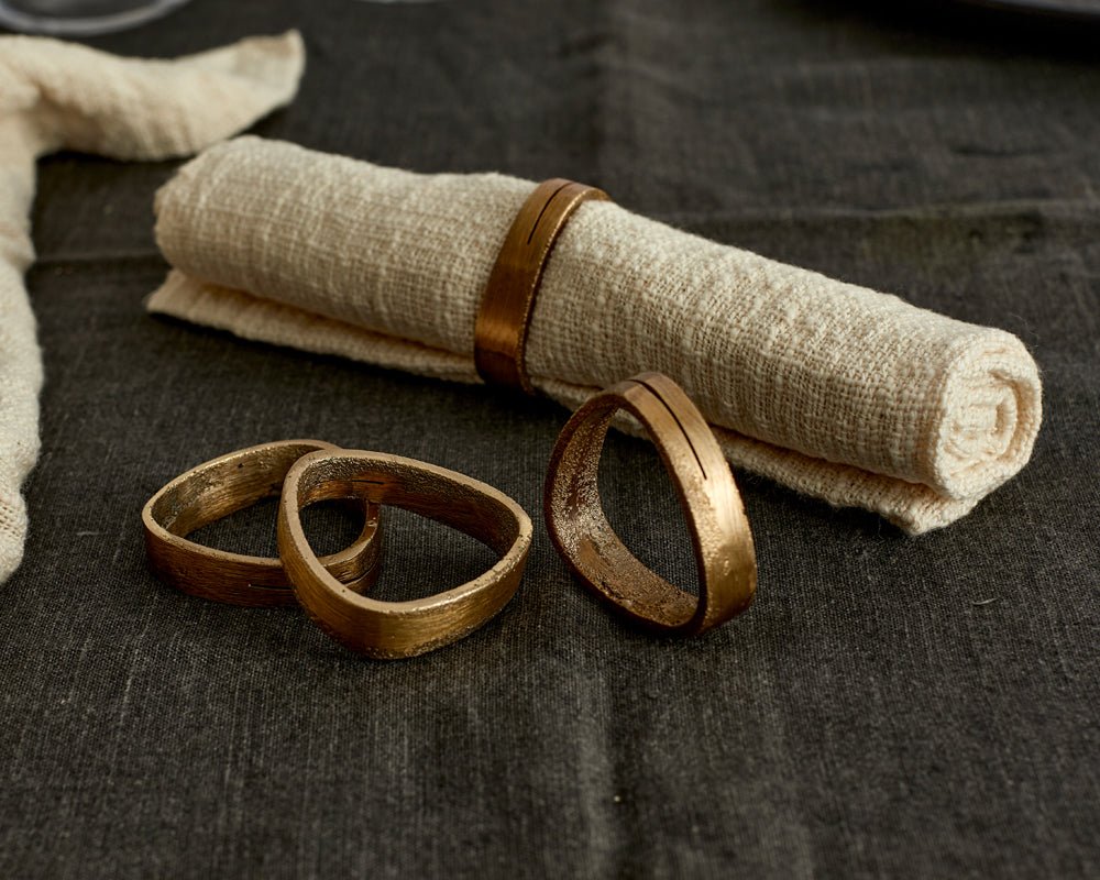Agnes brass napkin rings set of 4 handcrafted table accents styled from another angle
