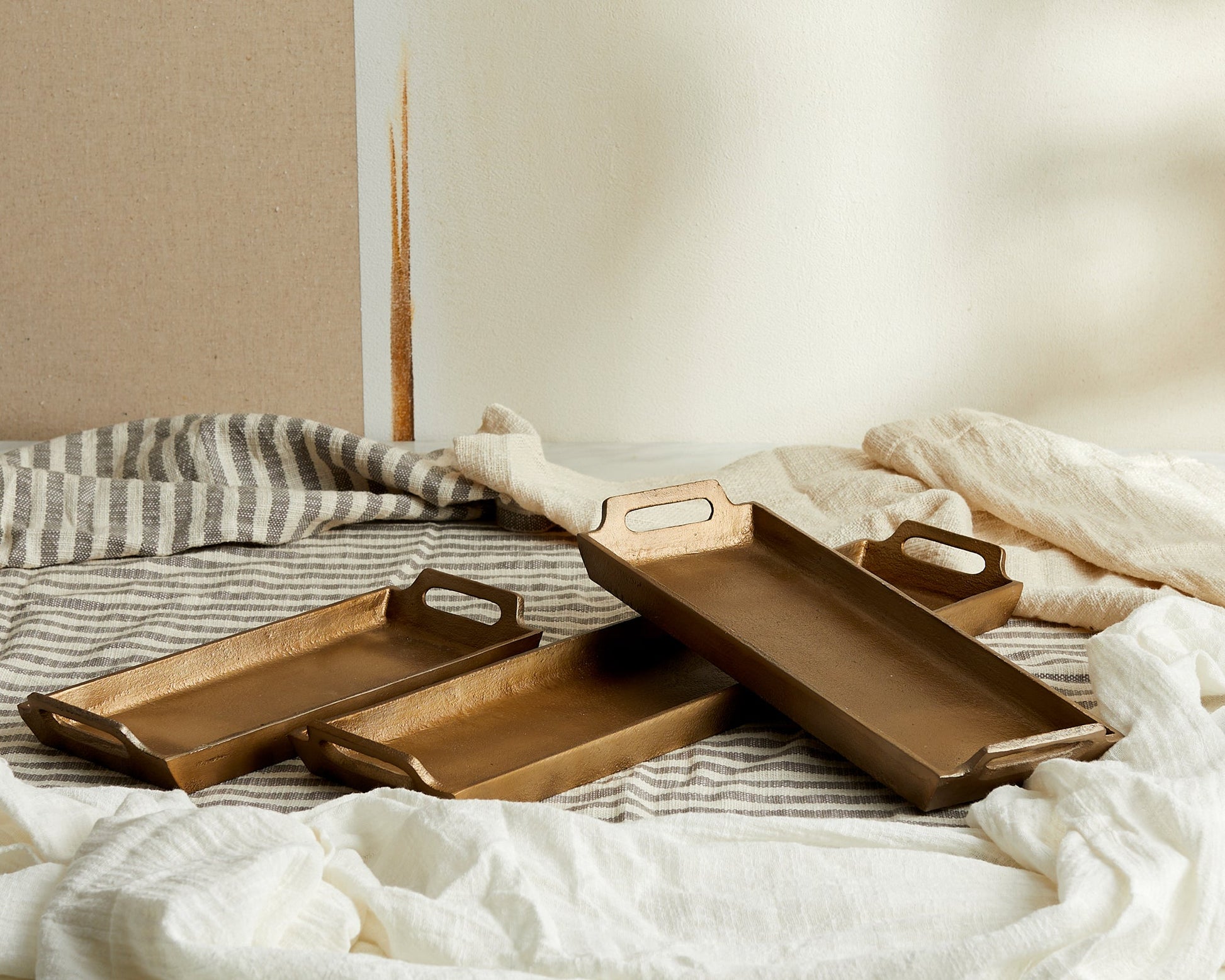 Alderley gold round serving trays all three sizes, displayed together at an angle
