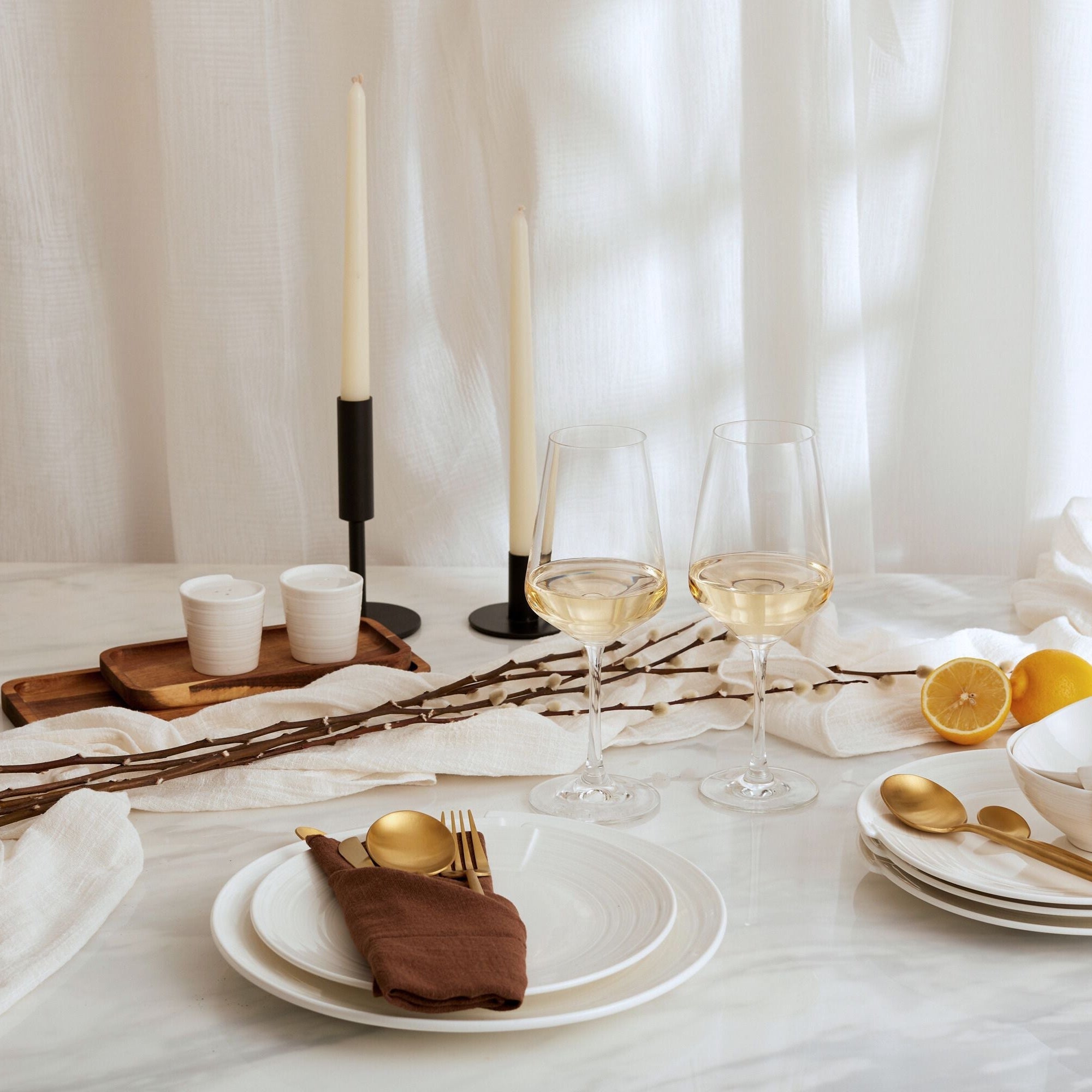 Alverley White gauze table runner in soft cotton, styled down the centre of a marble table with gold cutlery and ceramic tableware for poetic countryside dining.